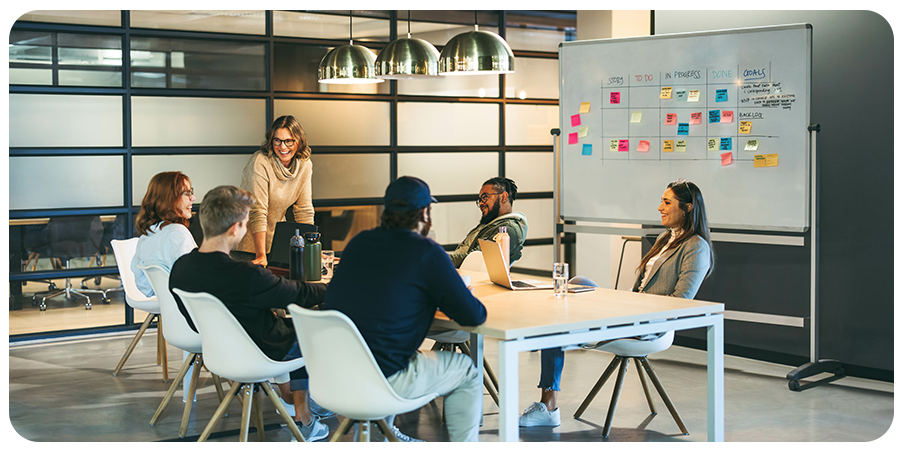 a team of people collaborating at a conference table